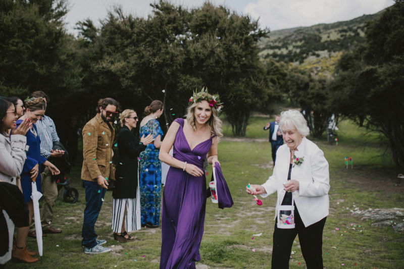 bridesmaid and grandma throwing petals
