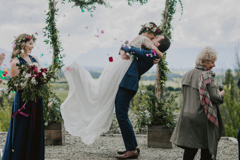 groom lifting ride up for first kiss