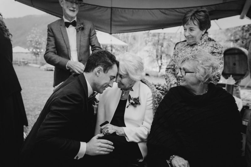 groom having special moment with grandmother