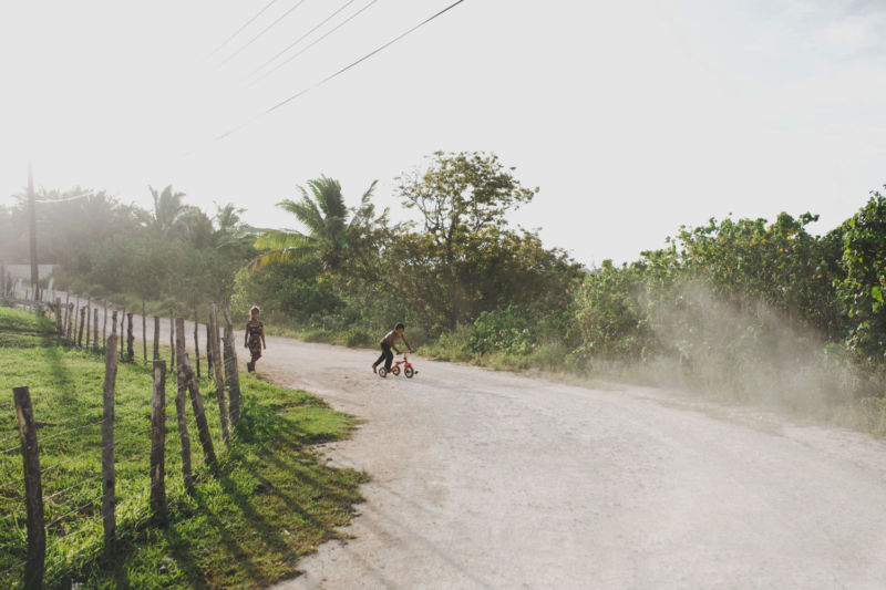 kids playing on dusty road vava'u