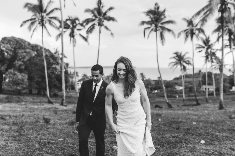 bride and groom walking in plantation