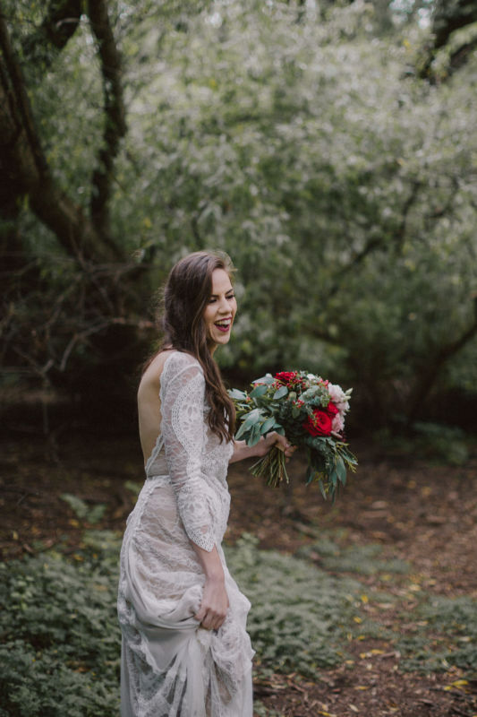 candid of bride in forest