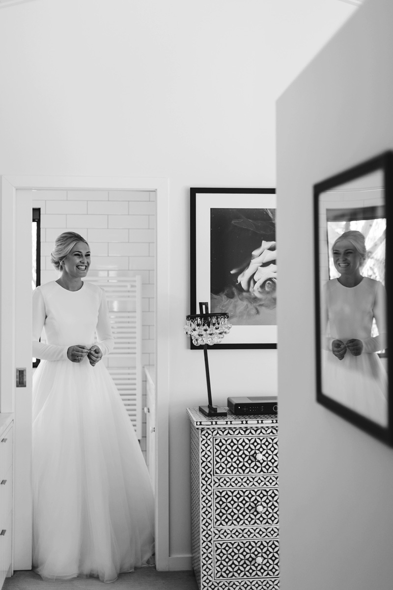 bride appearing from bathroom
