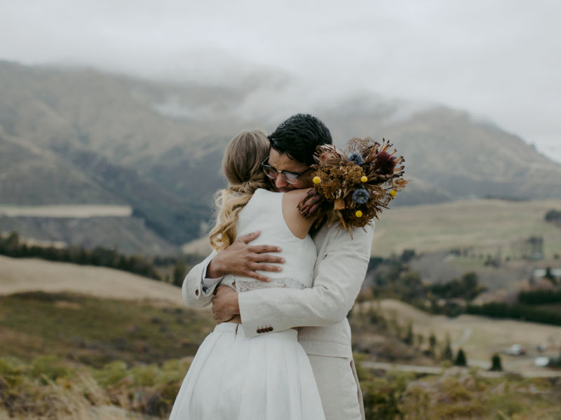 bride and groom hugging
