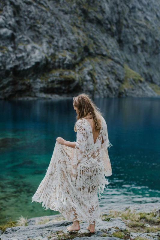 bride barefoot on lake edge
