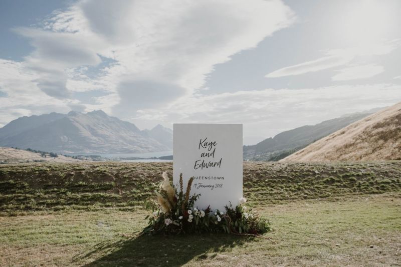 wedding welcome sign with mountains in background