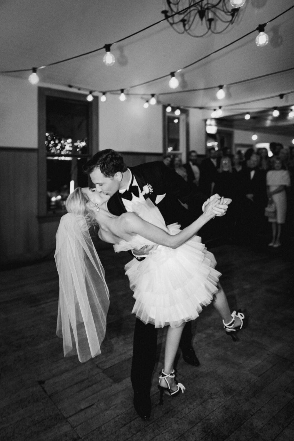 Olivia and Oliver dip kiss on the dancefloor during their first dance at The Winehouse