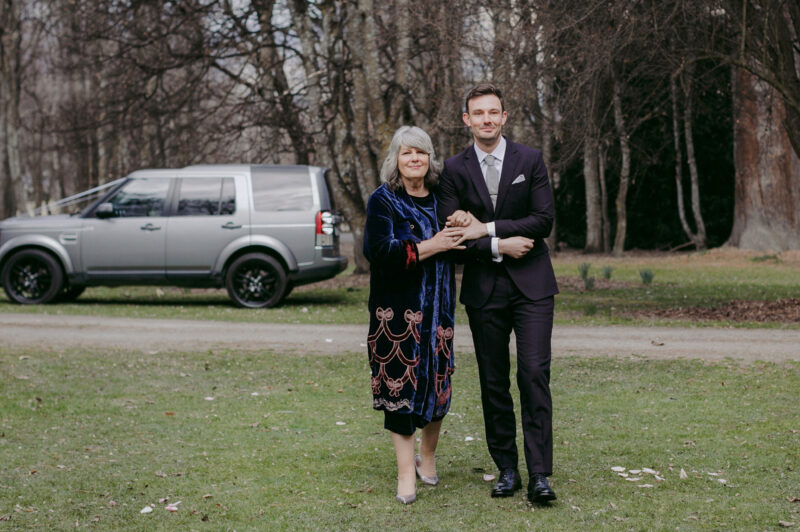 Groom and his mum walking up the aisle