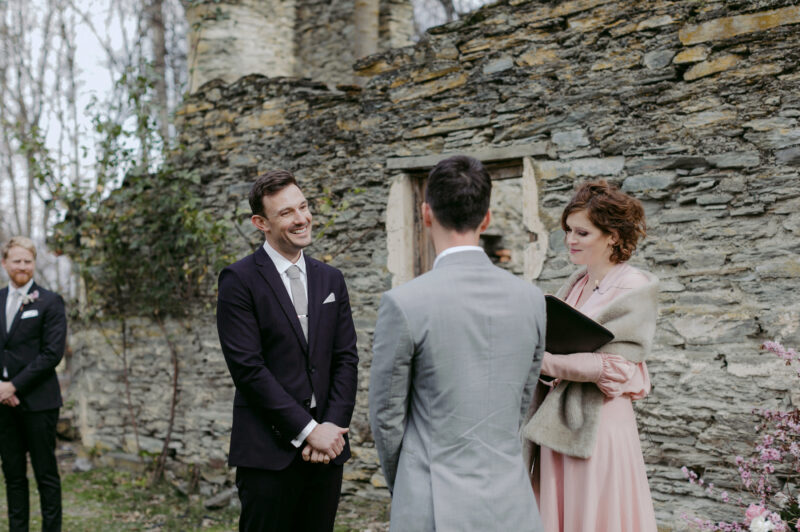 Steve looks lovingly at Liam at the beginning of the ceremony