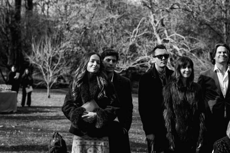 candid of guests watching the ceremony