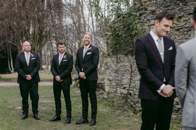 Groomsmen watch on proudly