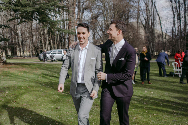 close up of Liam and Steve just married, walking back down the aisle with huge smiles
