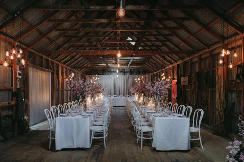 Liam and Steves Reception venue with tables, candles and flowers, set up whole room