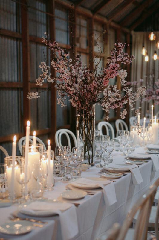 Close up of Liam and Steves Reception venue with tables, candles and flowers