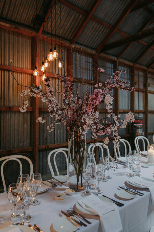 Close up of Liam and Steves Reception venue with tables, candles and flowers