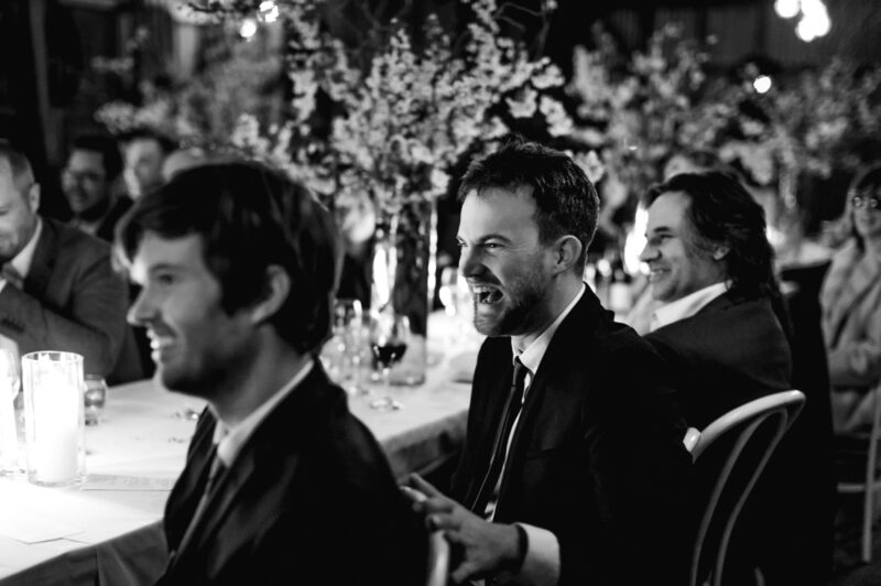 guests laughing at speeches