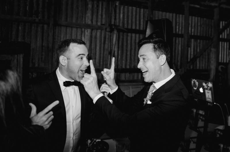 Dancefloor moment with 2 groomsmen in nice suits