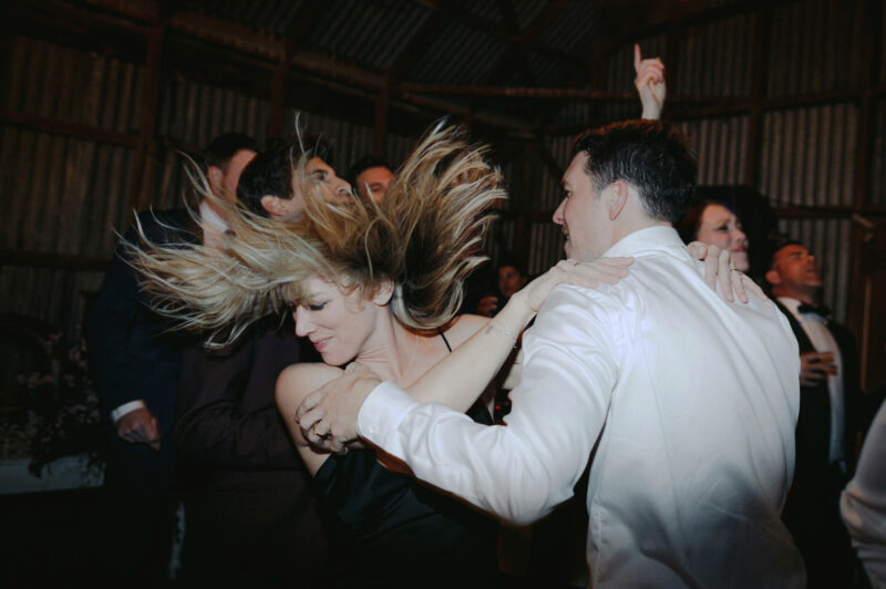Liam dancing with friend and her hair is flying in the air