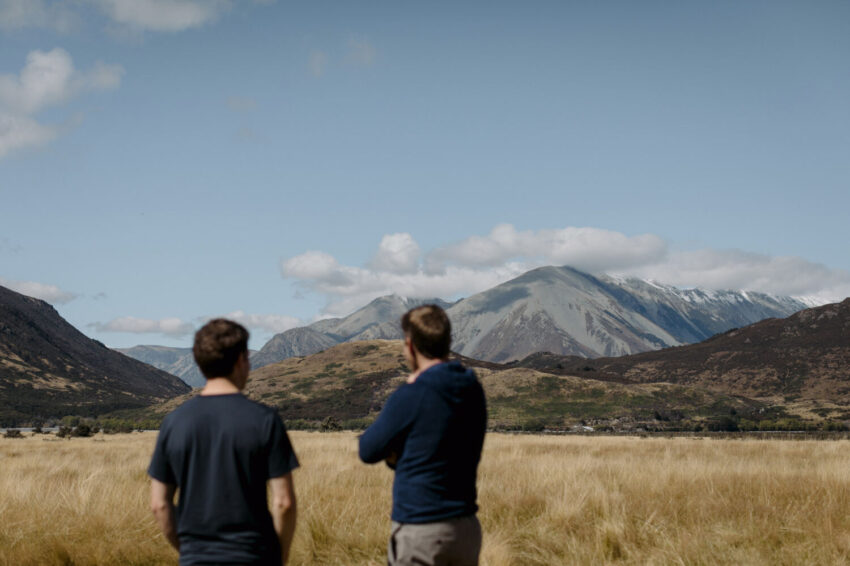 Two men looking at mountain views