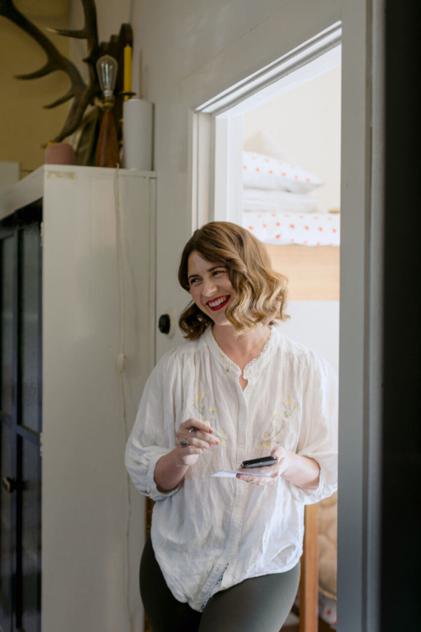 Woman leaning in doorway