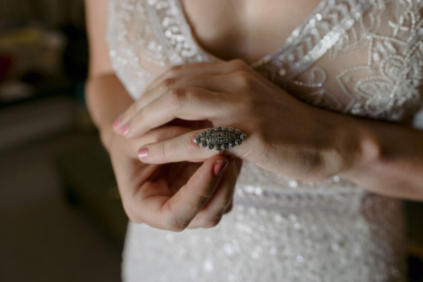 close up of bride adjusting ring