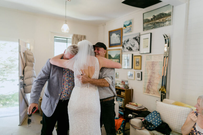 Men hugging bride