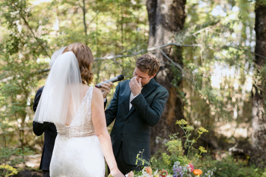 Groom saying vows during ceremony