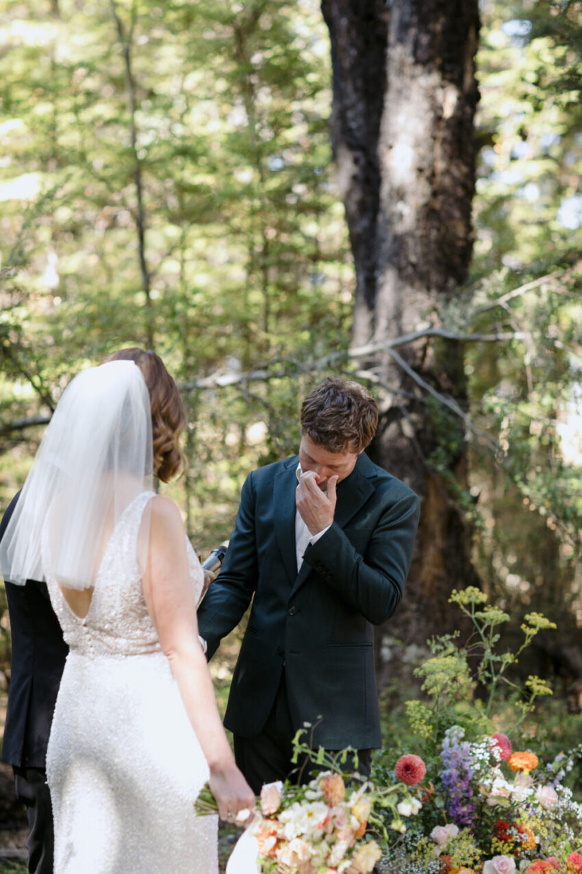 Groom saying vows during ceremony