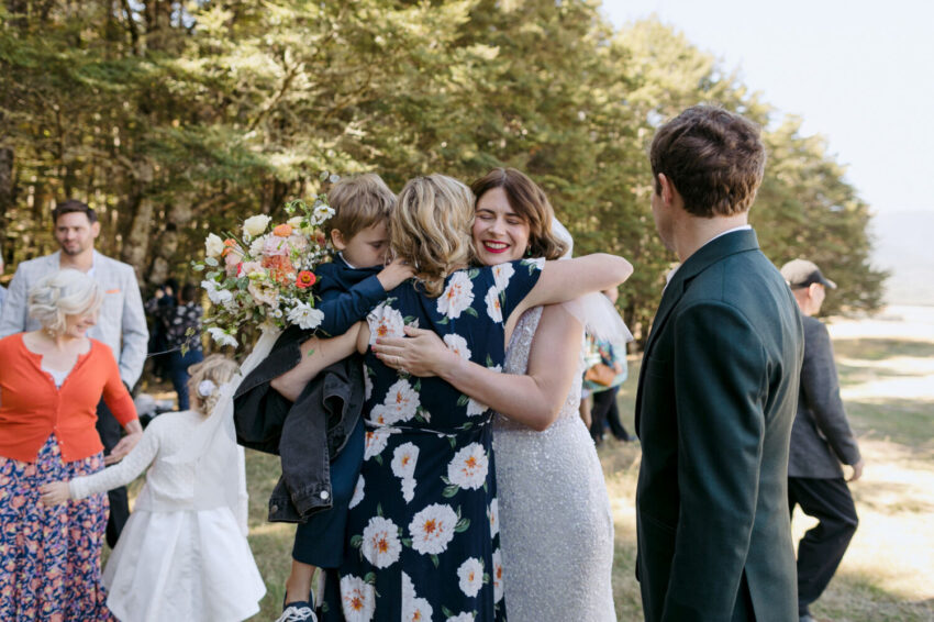 Bride hugging guests