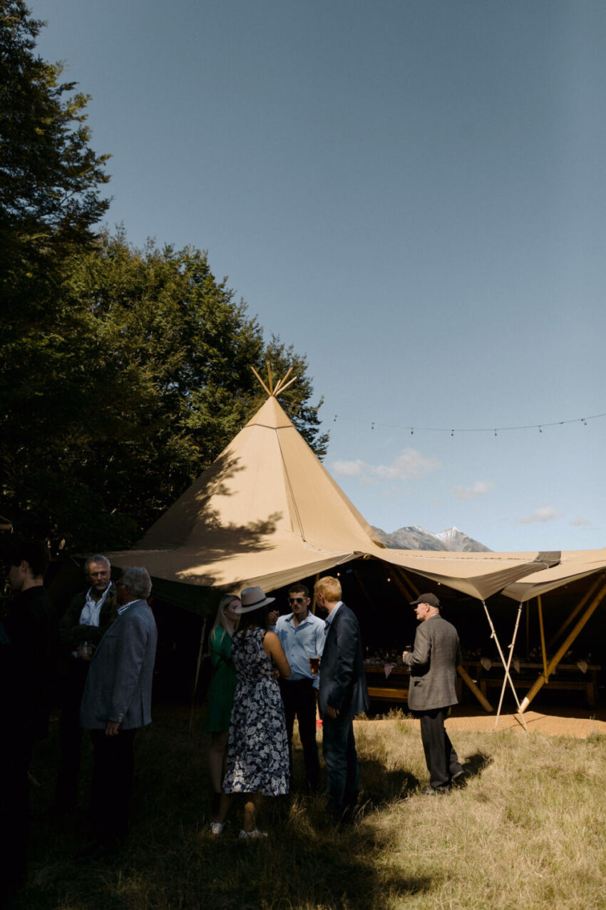 Guests mingling outside tipi