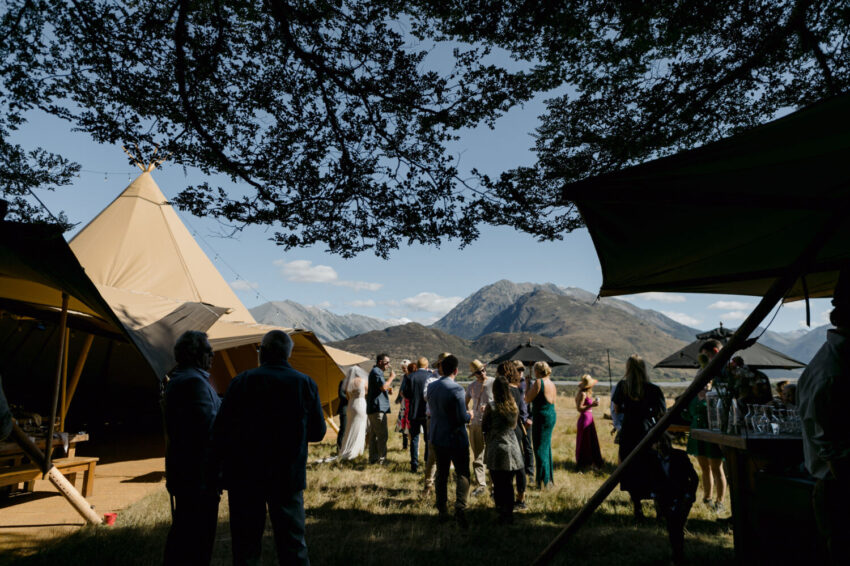Guests mingling outside tipi