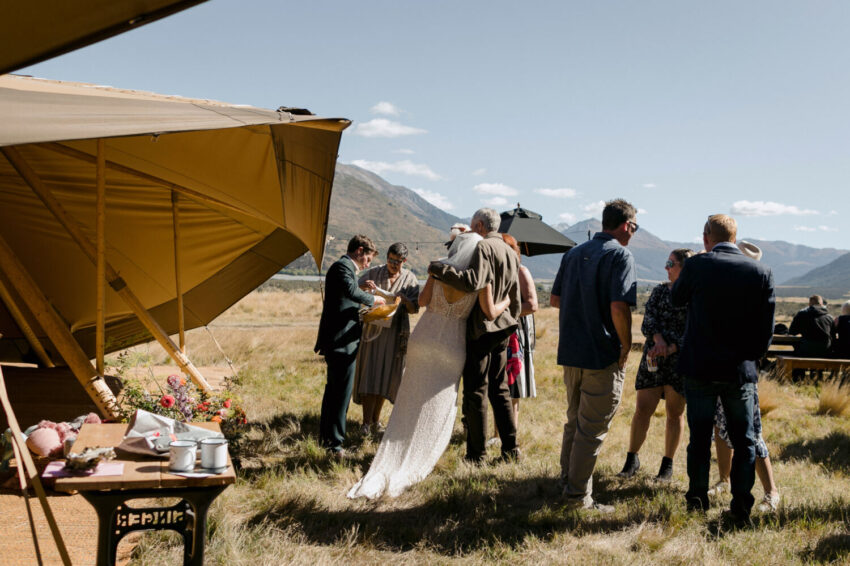 Guests mingling outside tipi