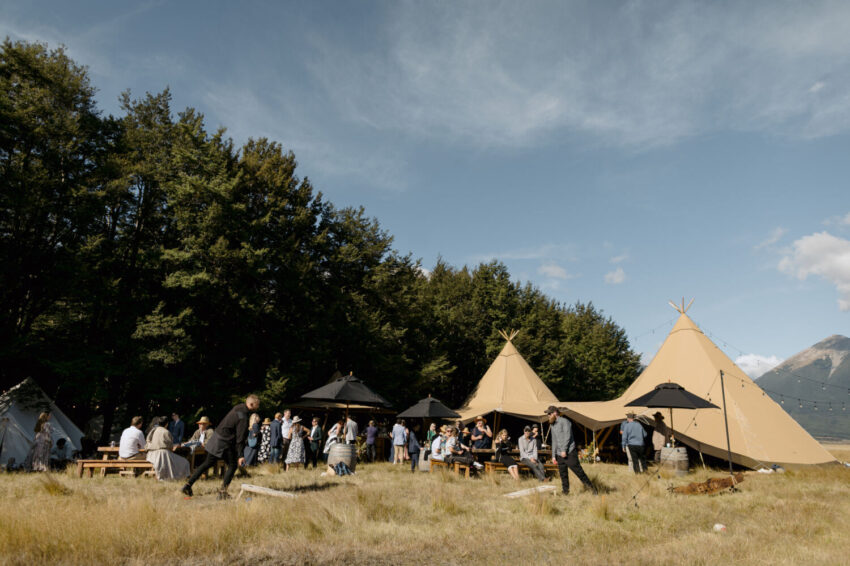 Guests mingling outside tipi