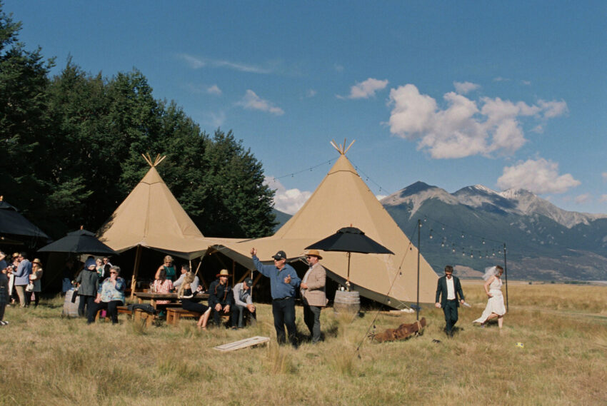 Guests mingling outside tipi