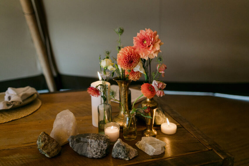 Table arrangement inside the tipi at the wedding reception