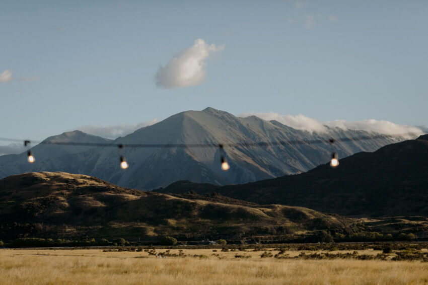 Festoon lights with mountain backdrop
