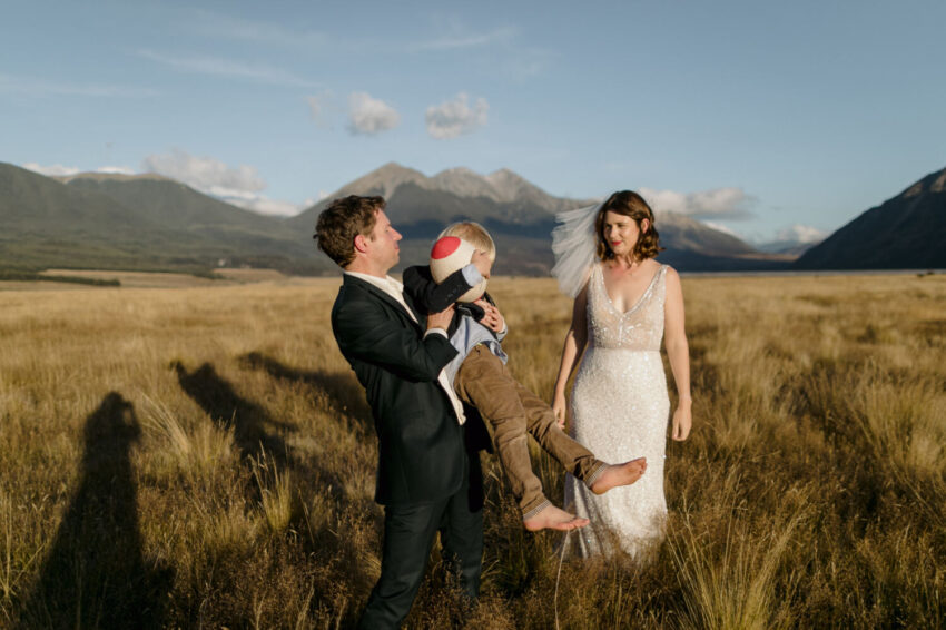 Groom playing with children