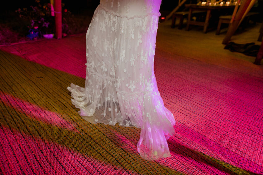 Bride swirling her dress on the dancefloor closeup