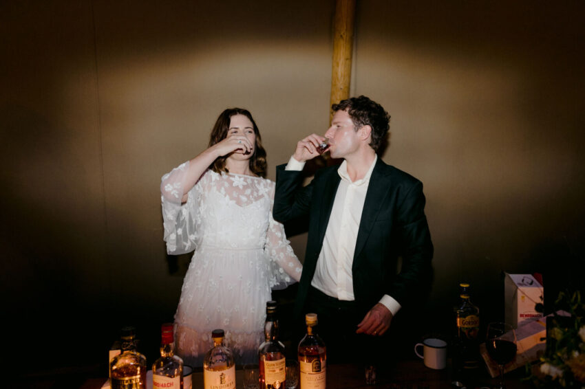 Bride and Groom drinking whisky