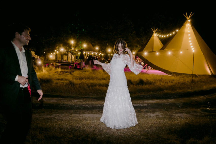 Bride and Groom dancing outside the tipis