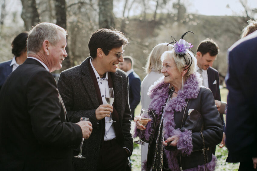 Candid of guests, young and old mingling together