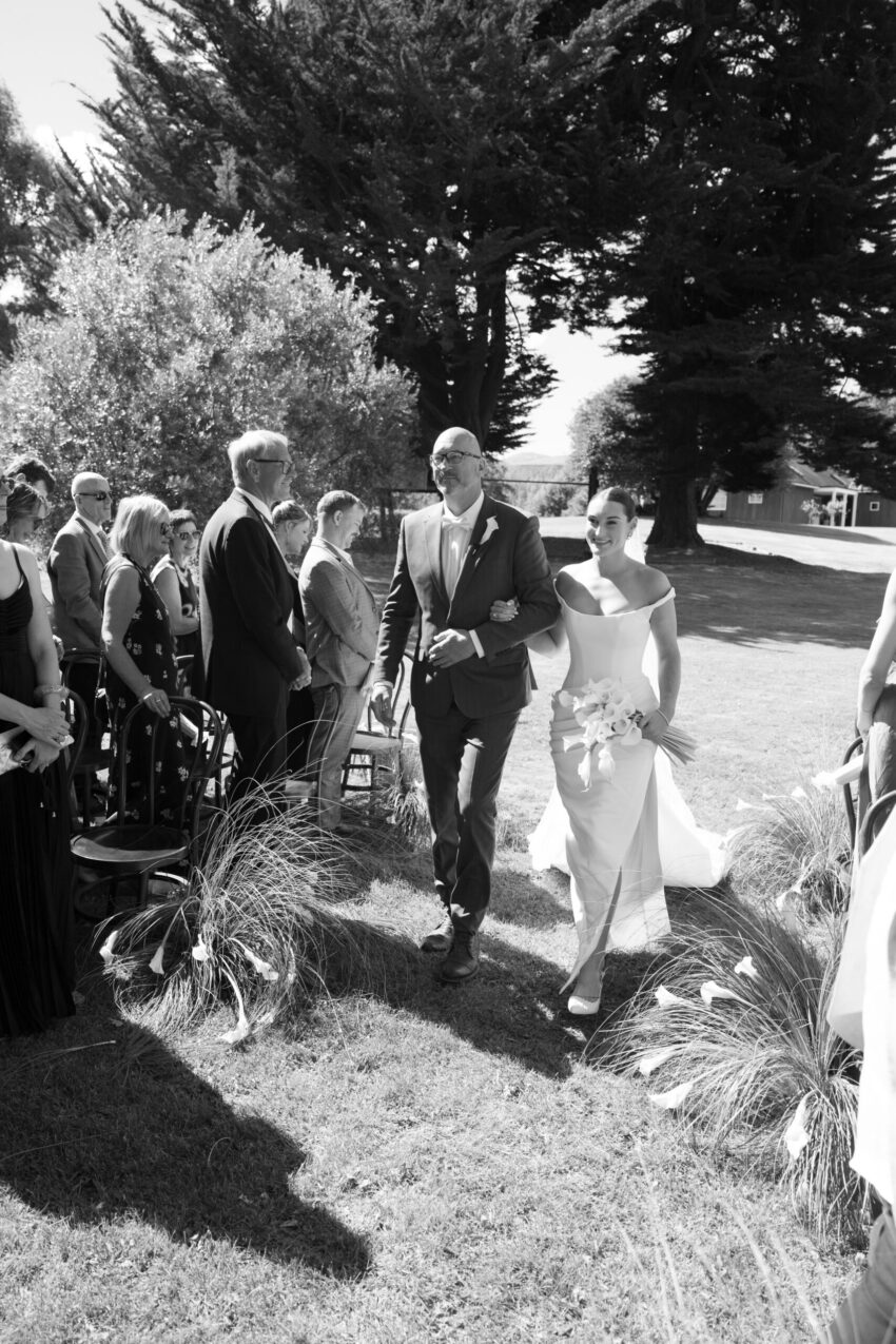 Bride being led down the aisle by her father