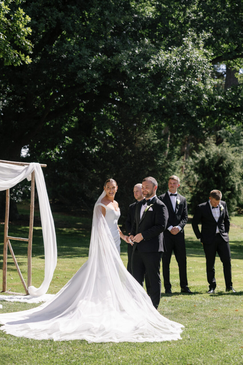 candid ceremony shot of bride and groom