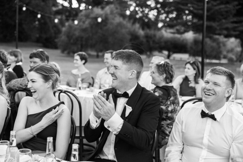 Guests laughing and having a great time at dinner