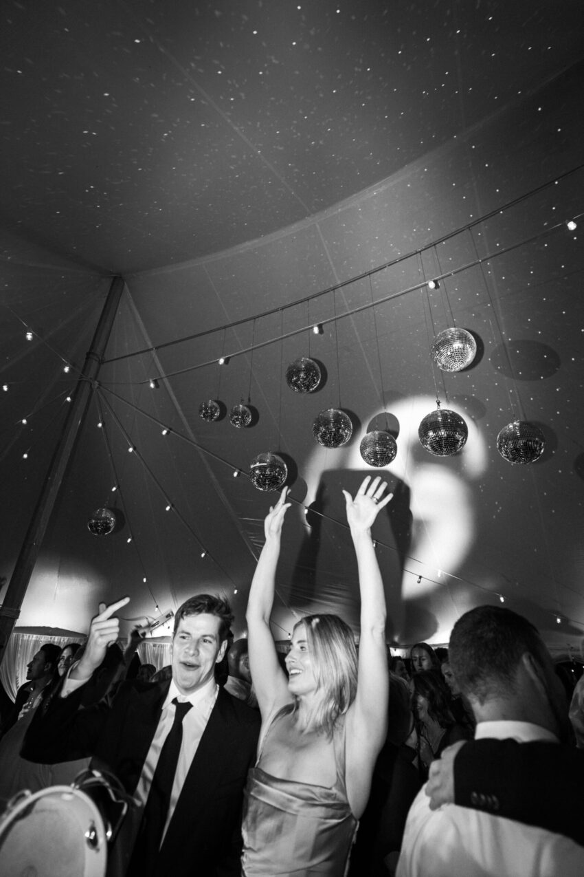 Guests on the dancefloor with hands in the air