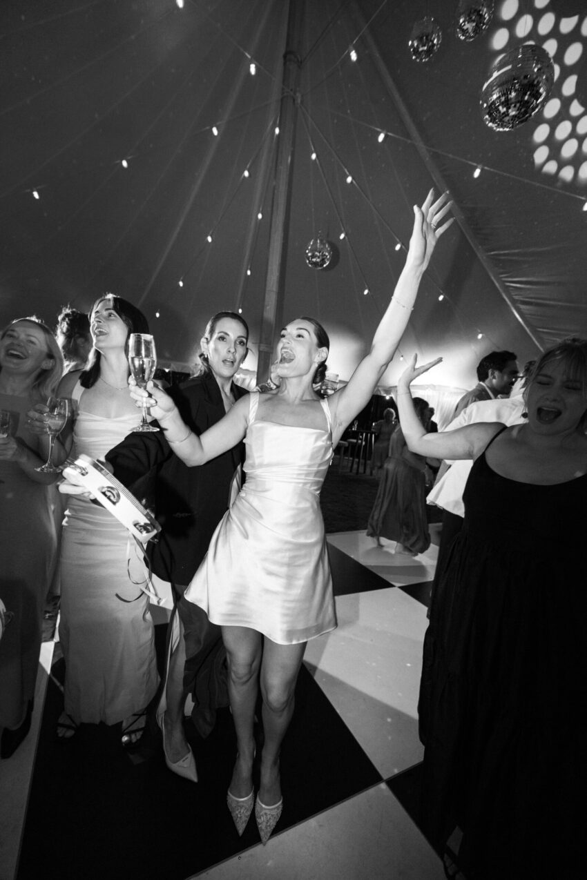 Bride and guests having fun on the dancefloor