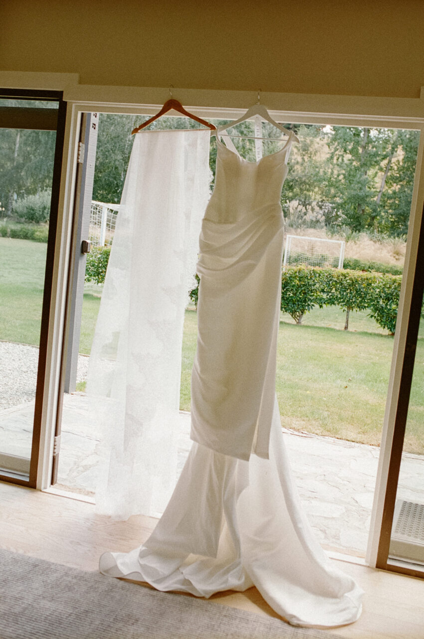 Dress and veil hanging in the doorway