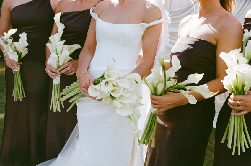 Close up of bride and bridesmaids hands and flower details
